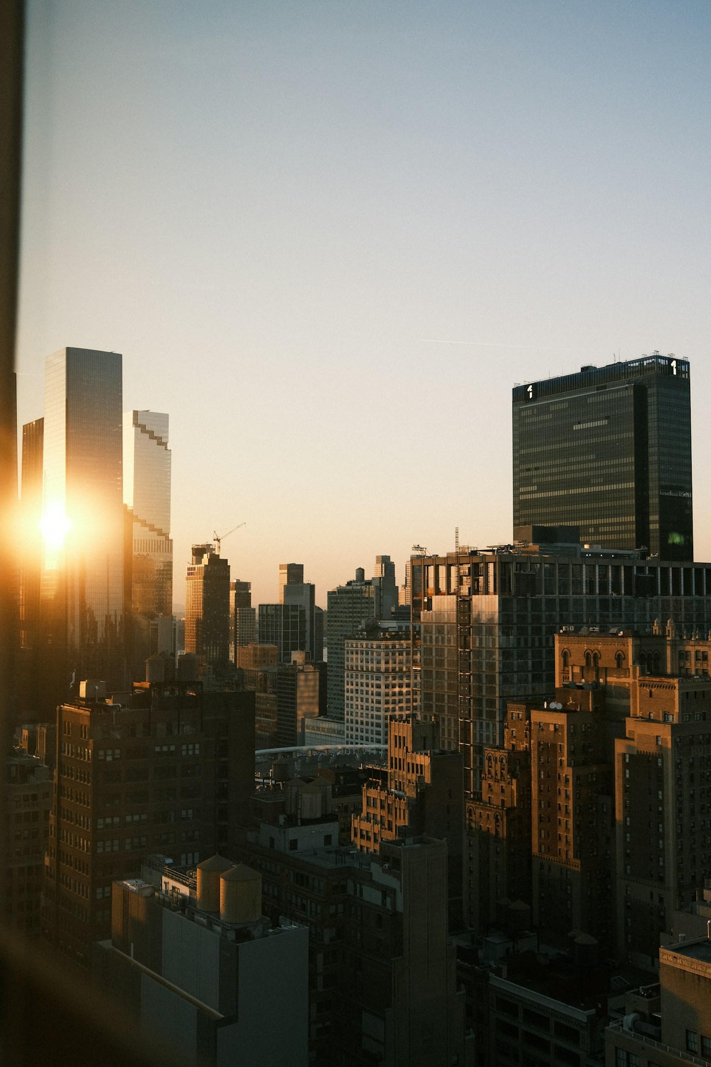 Manhattan rooftops seen from a New York building at sunset
